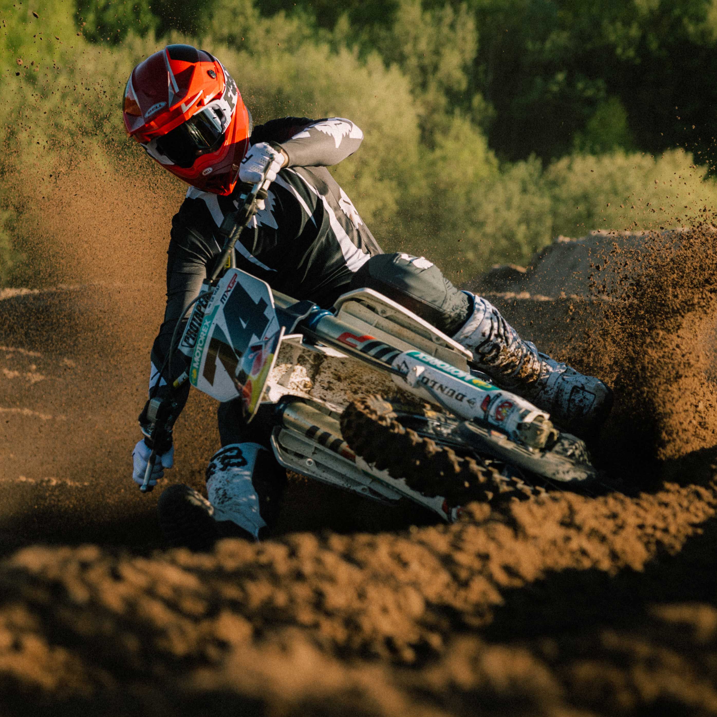 Man wearing Moto 10 GP on MX bike